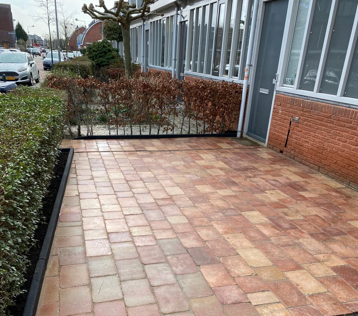 Voortuin reinigen voegen ypenburg
